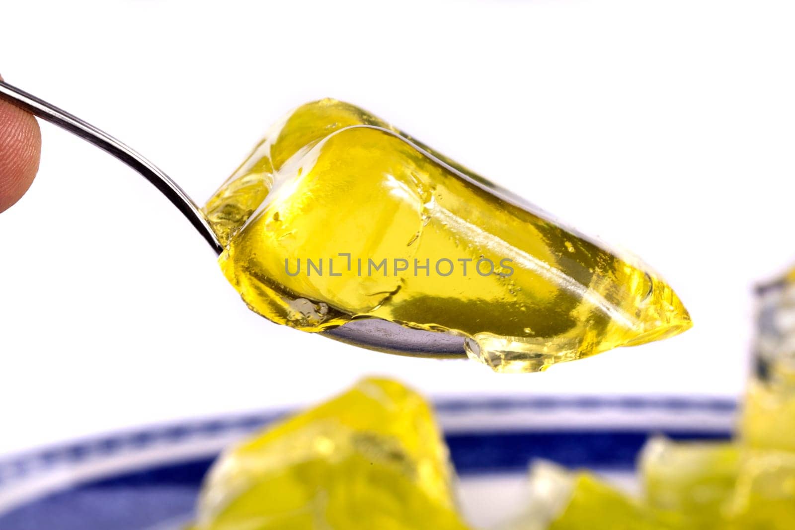 Close up view of several colorful gelatins isolated on a white background.