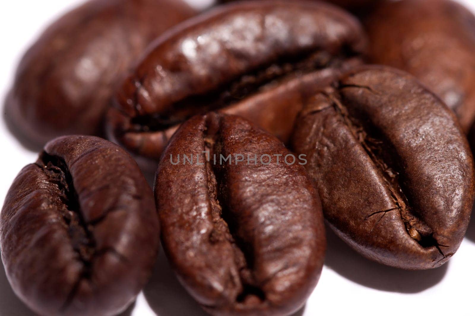 Close up view of a bunch of roasted beans of coffee.