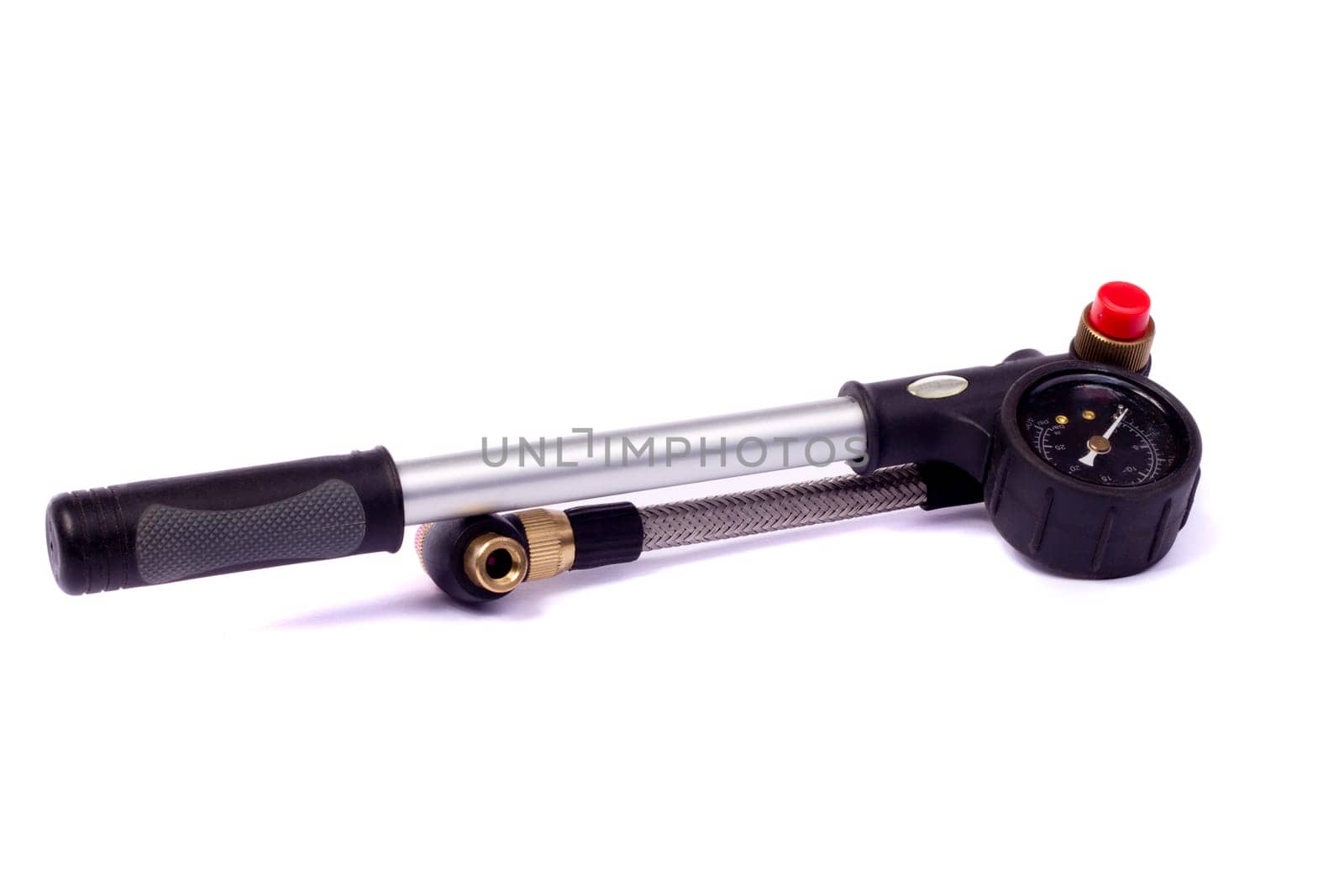 Close up view of a bicycle air pump isolated on a white background.