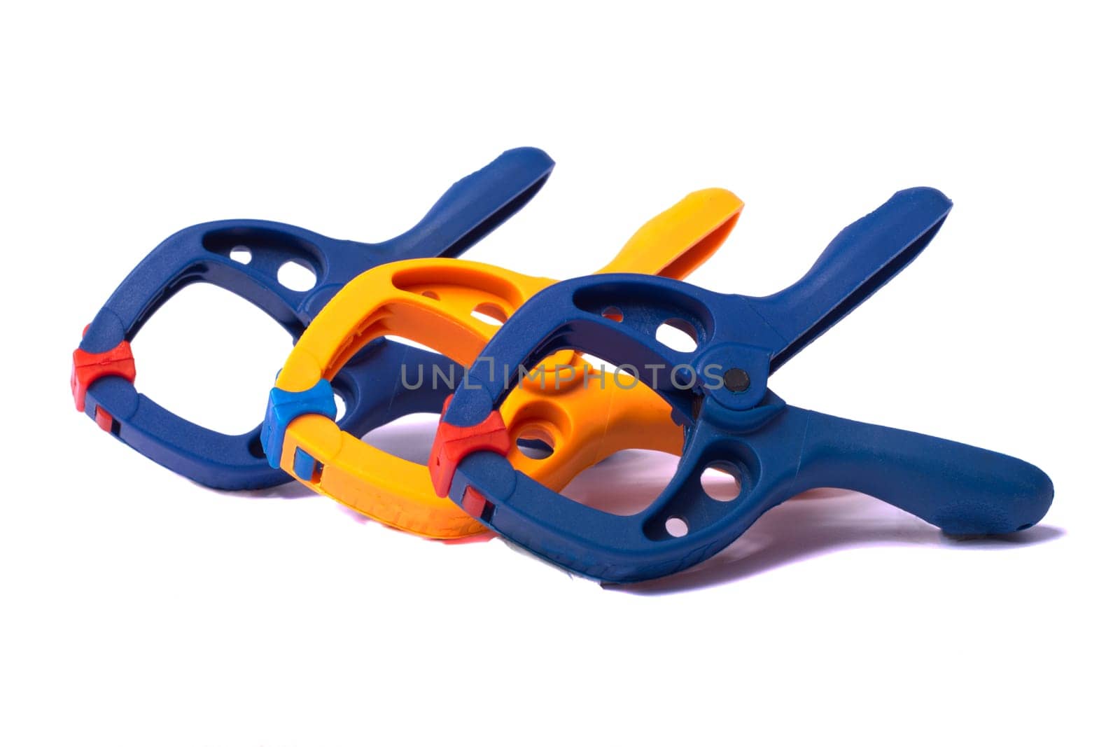 Close up view of some clamps isolated on a white background.
