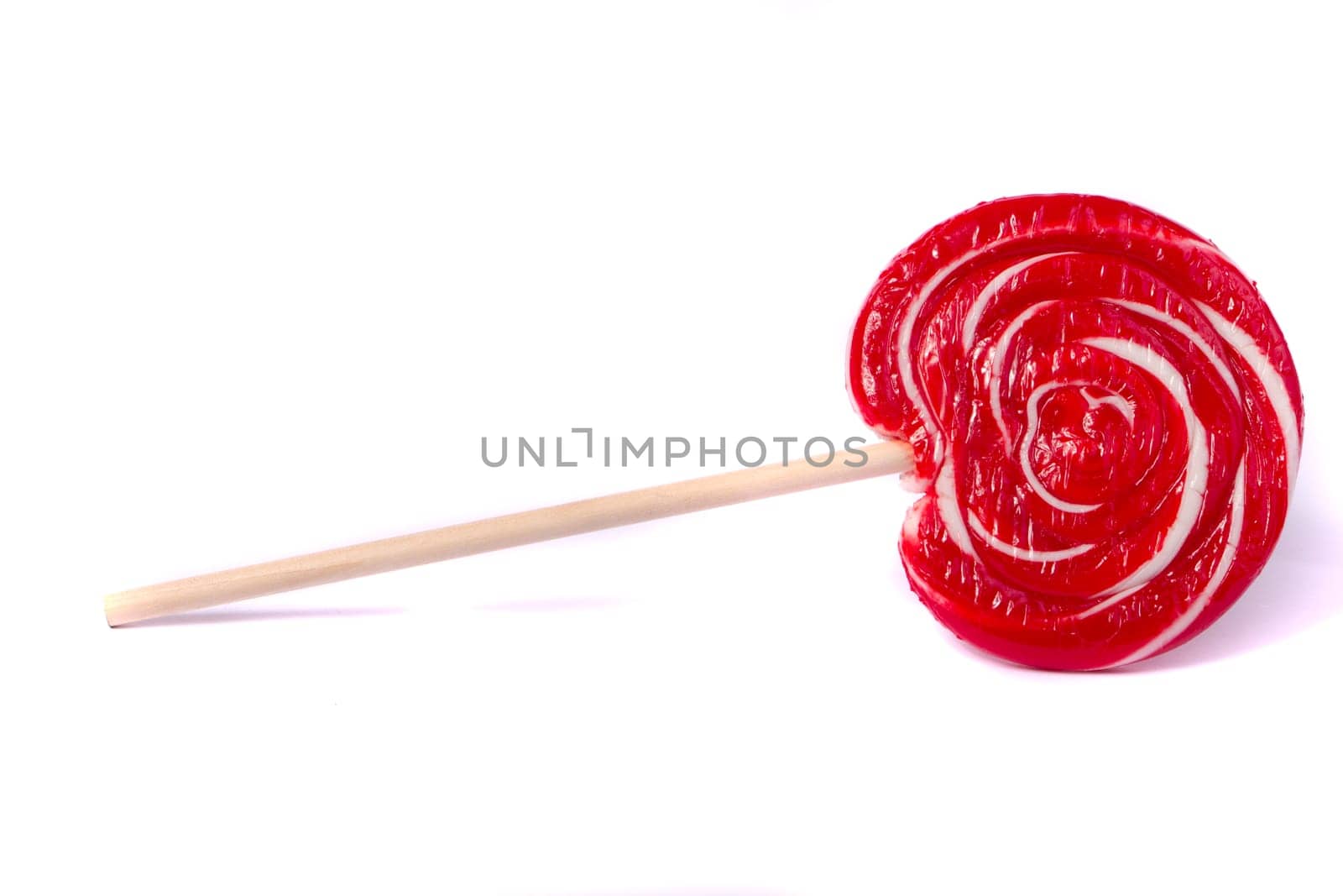 Close up view of a sweet lollipop isolated on a white background.