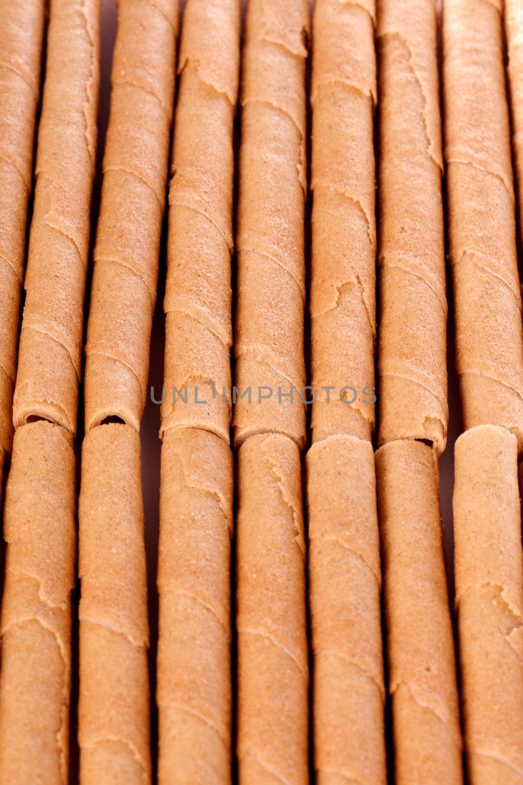 Close up view of a bunch of cookie sticks isolated on a white background.