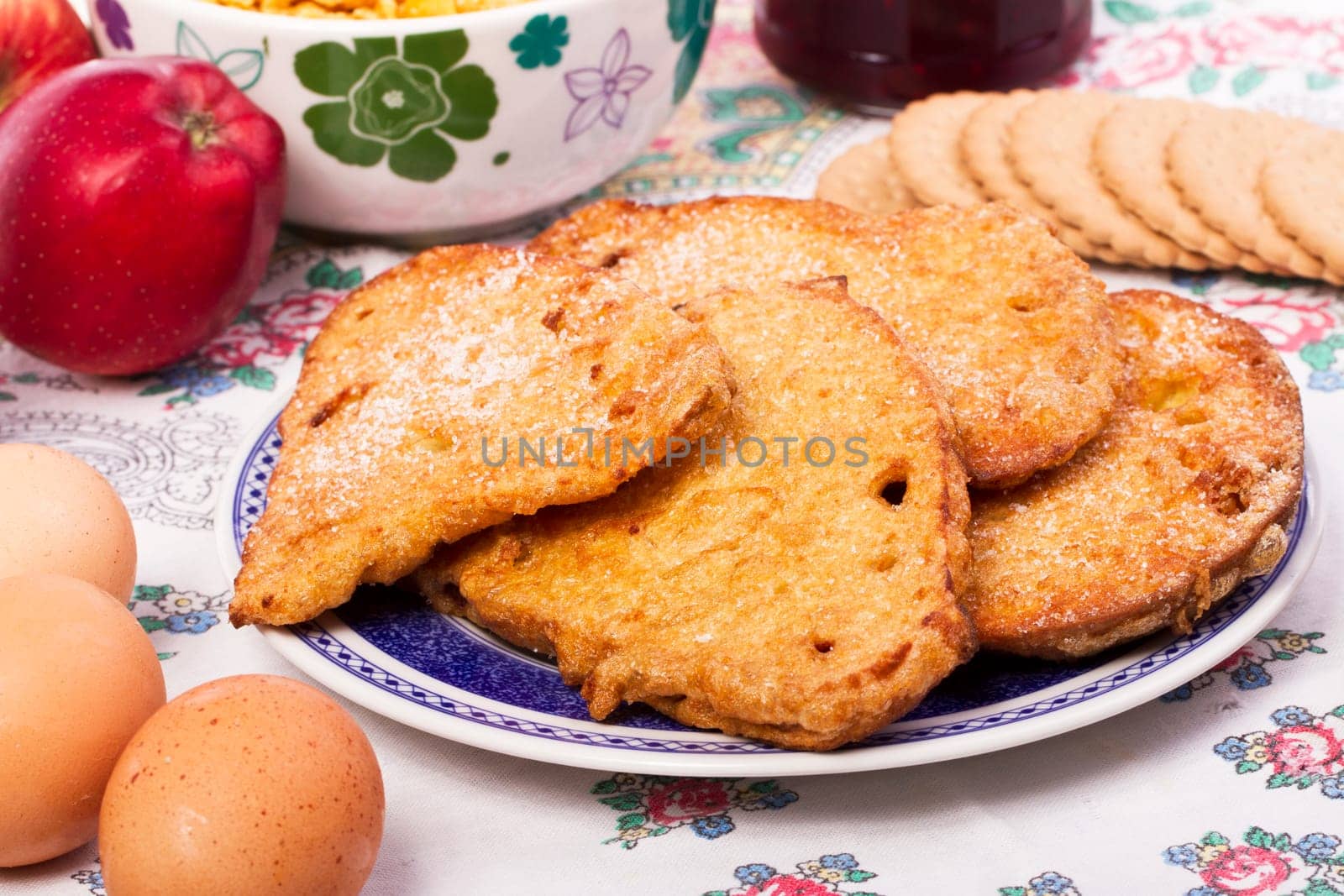 Close up view detail of several golden slices of bread sprinkled with sugar.