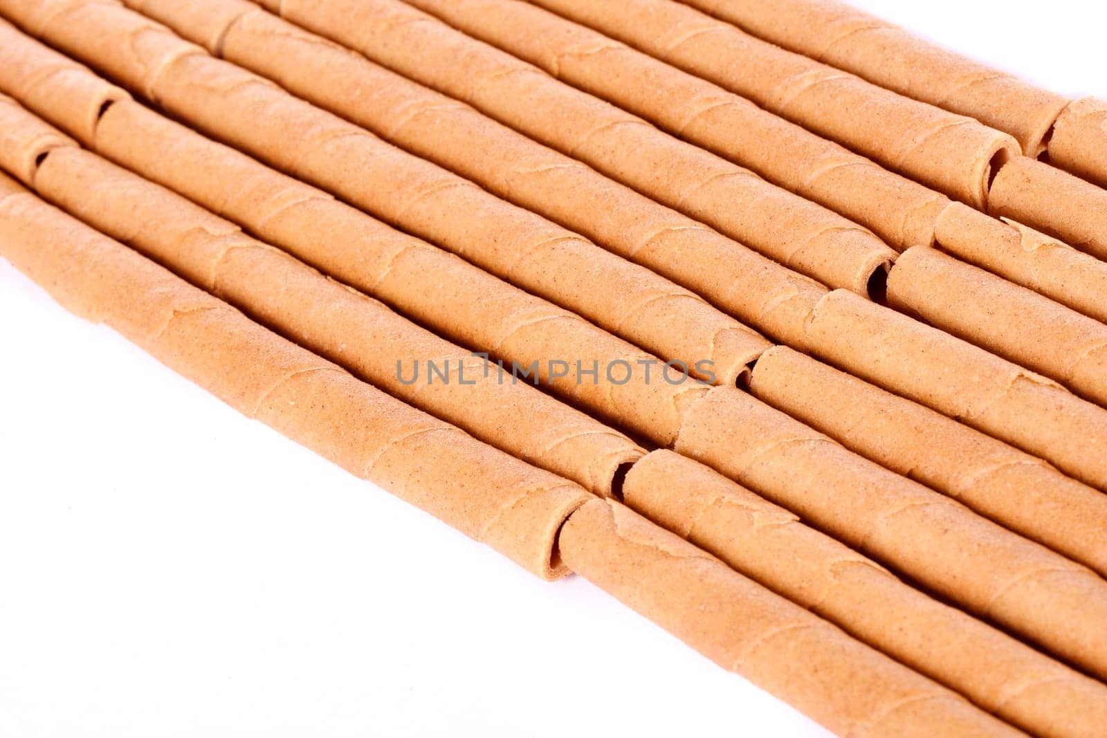 Close up view of a bunch of cookie sticks isolated on a white background.