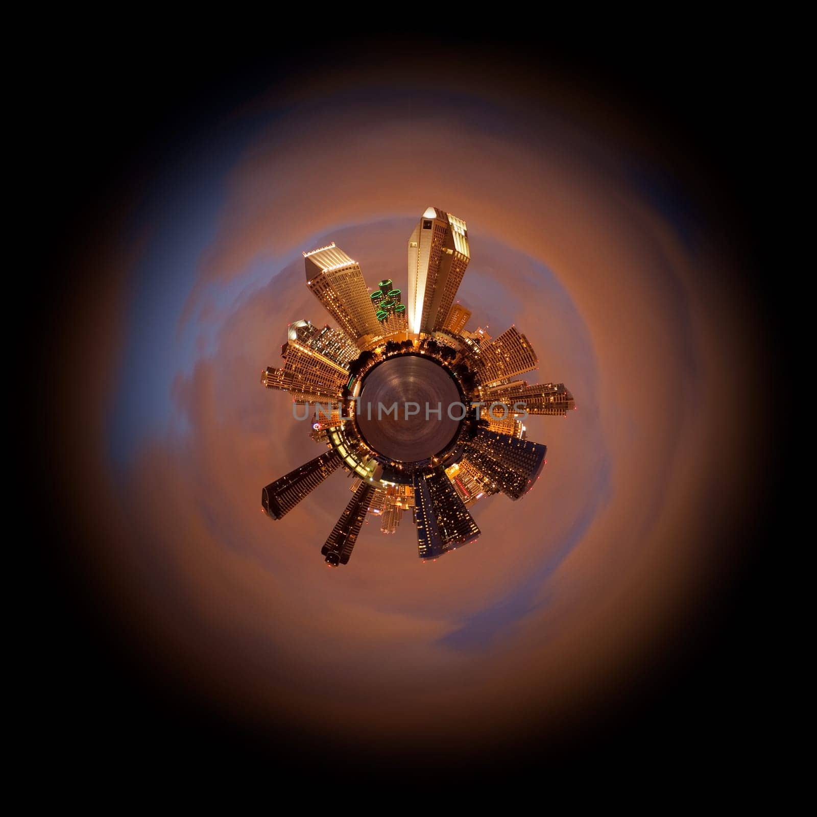 Sunset view of the San Diego City skyline converted into a planet view with orange clouds lit by the lights of the city