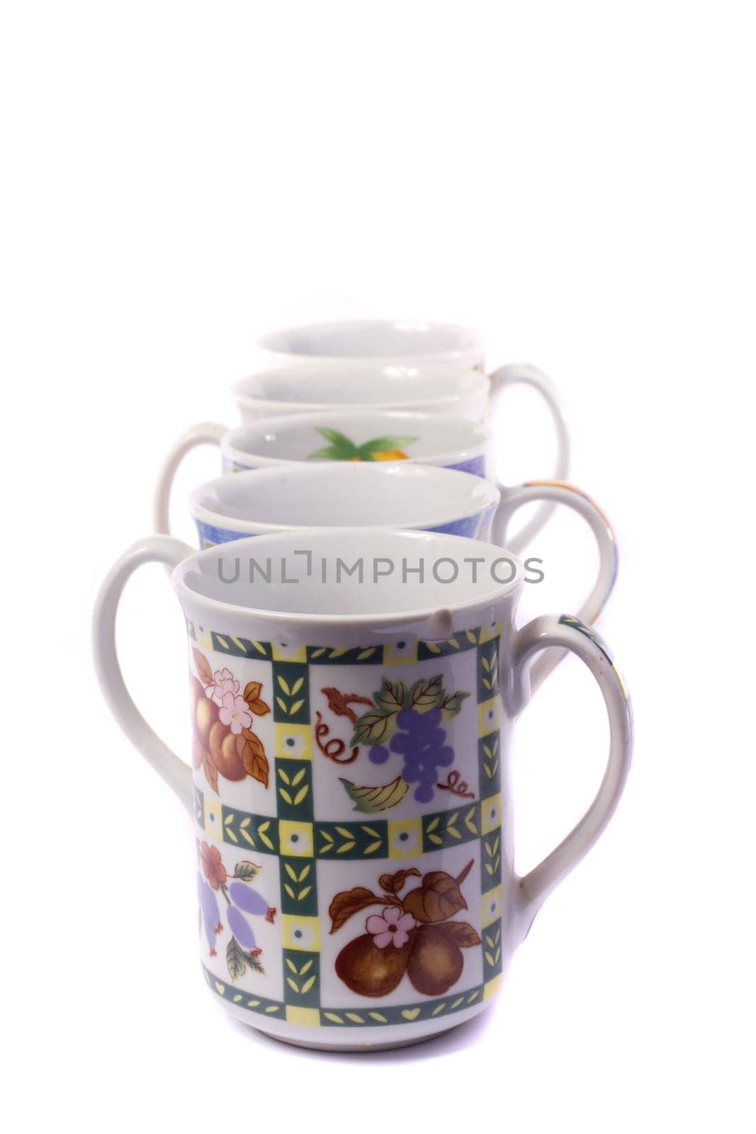 Close up view detail of some breakfast mugs isolated on a white background.
