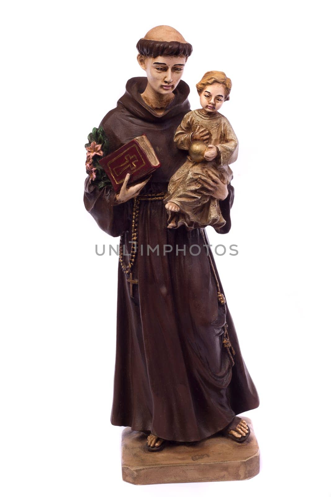 Close up view detail of a ceramic monk holding a child, isolated on a white background.