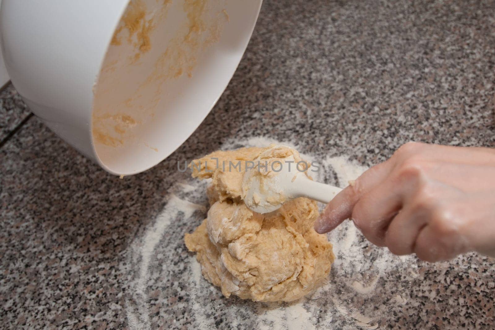 Stirred yeast dough and mixing spoon