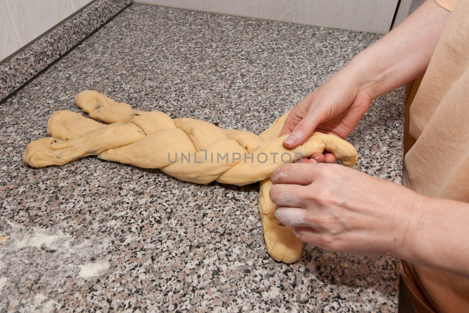 A yeast dough is braided into a yeast braid