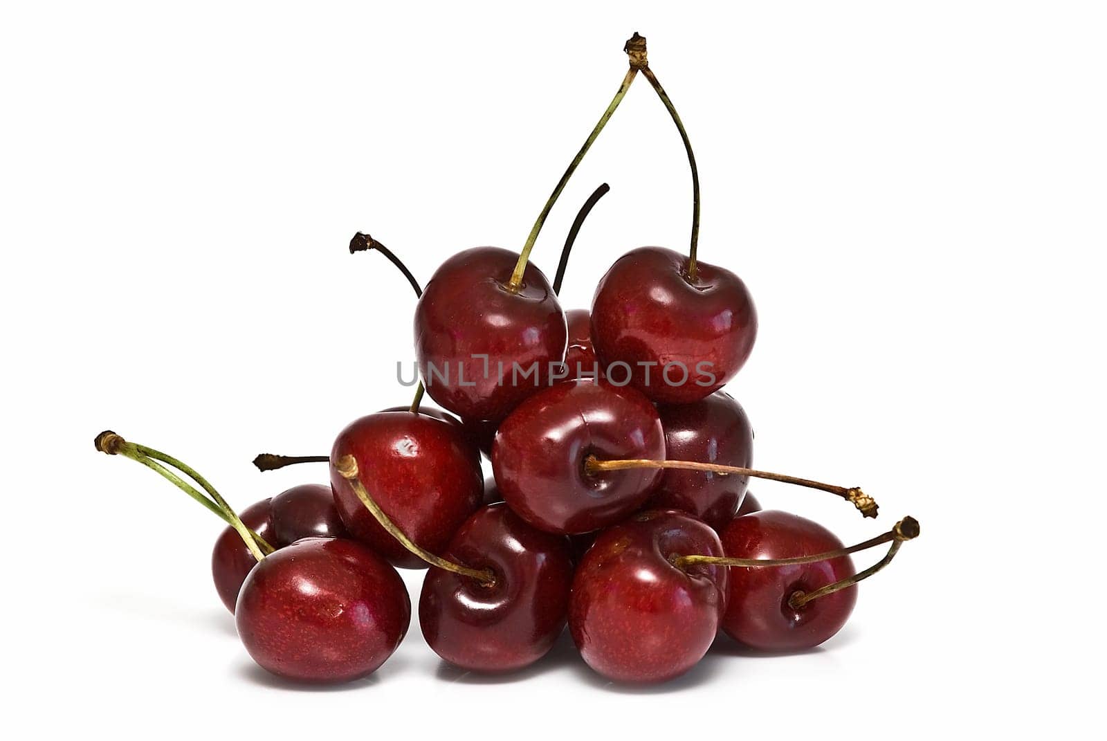 Fresh cherries isolated on a white background.