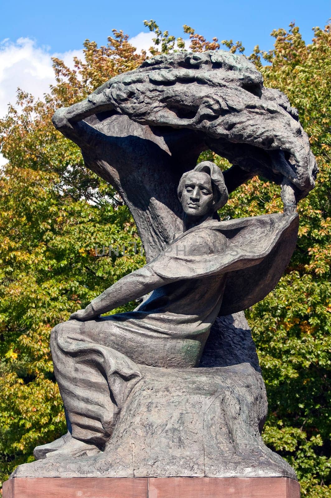 Monument, Frederic Chopin seeking inspiration under a willow tree in Warsaw, Poland.