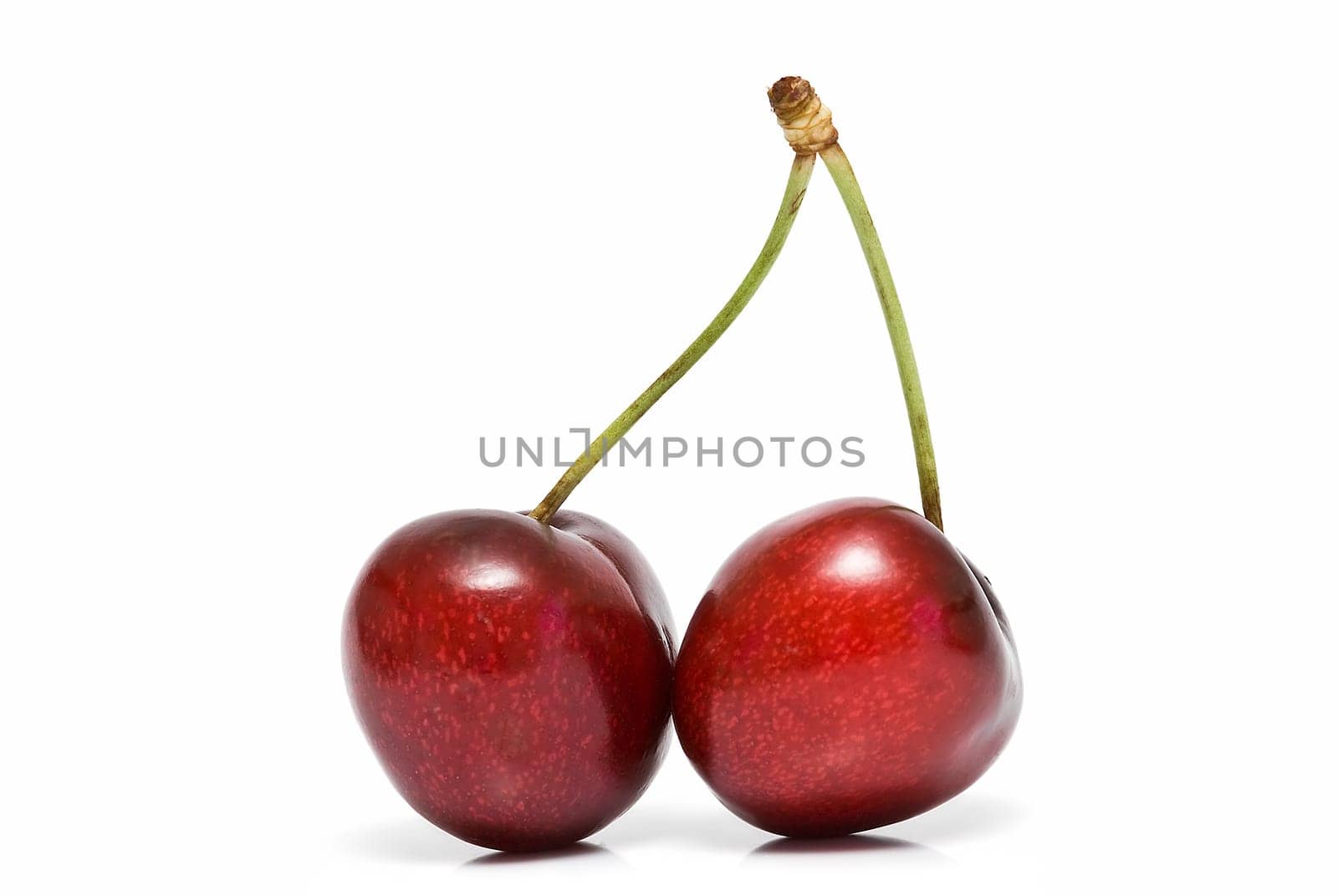Fresh cherries isolated on a white background.