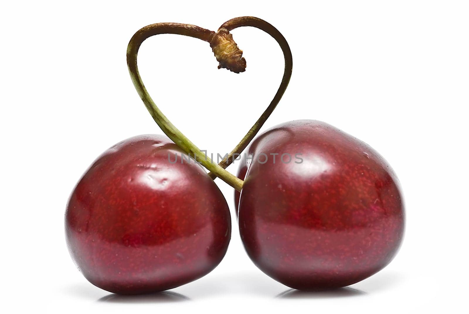 Fresh cherries isolated on a white background.