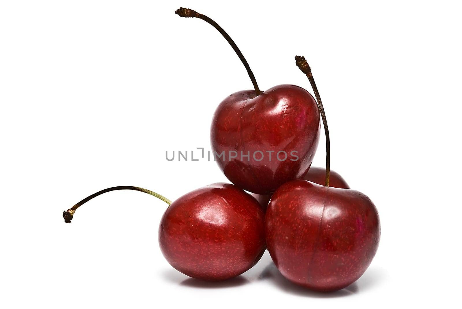 Fresh cherries isolated on a white background.