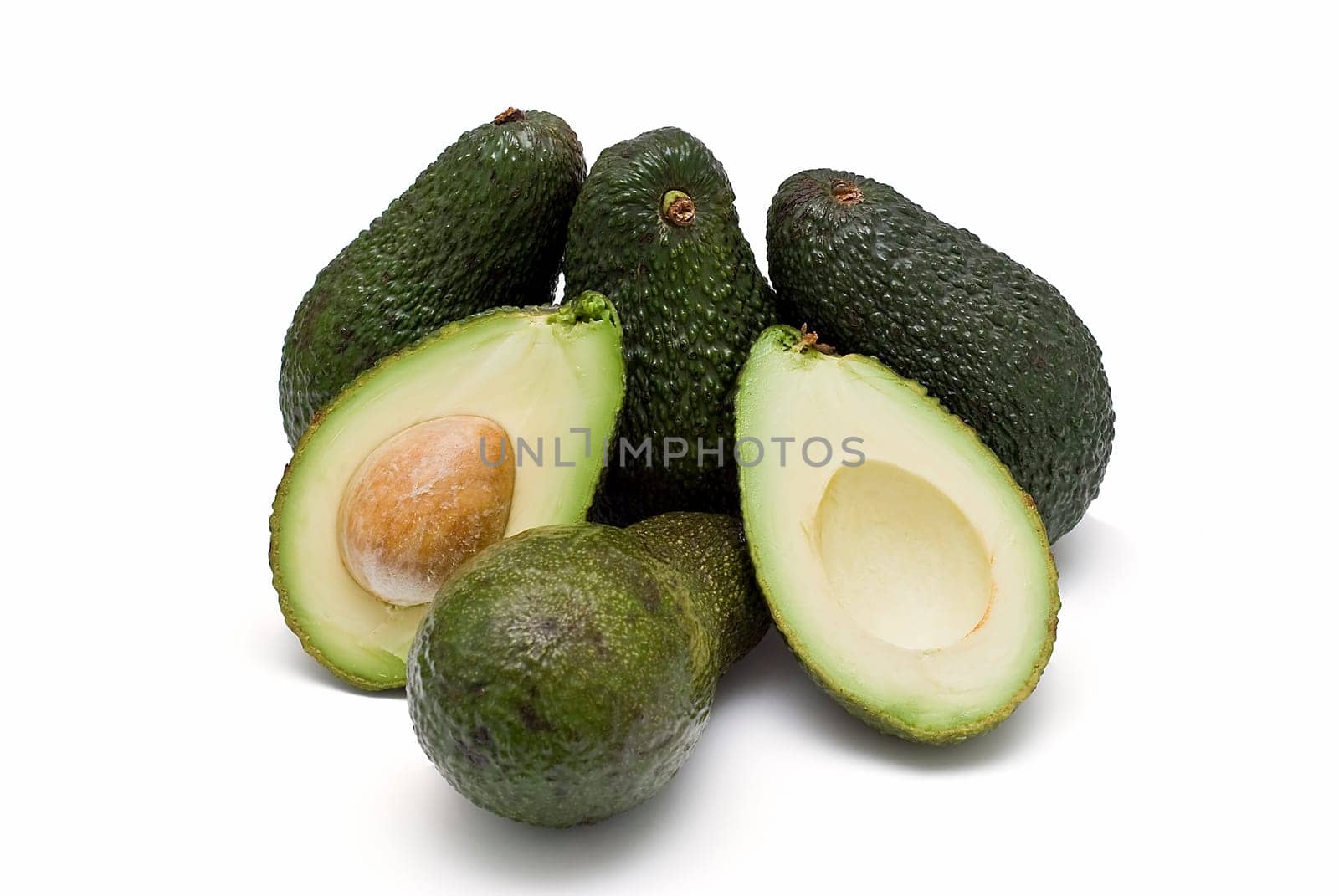 Fresh avocados isolated on a white background.