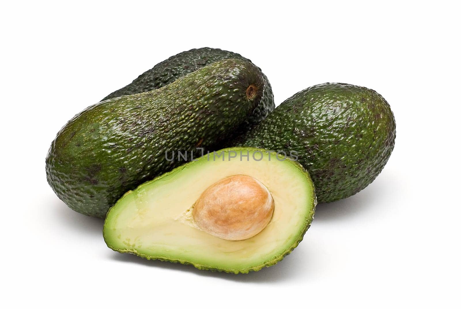 Fresh avocados isolated on a white background.