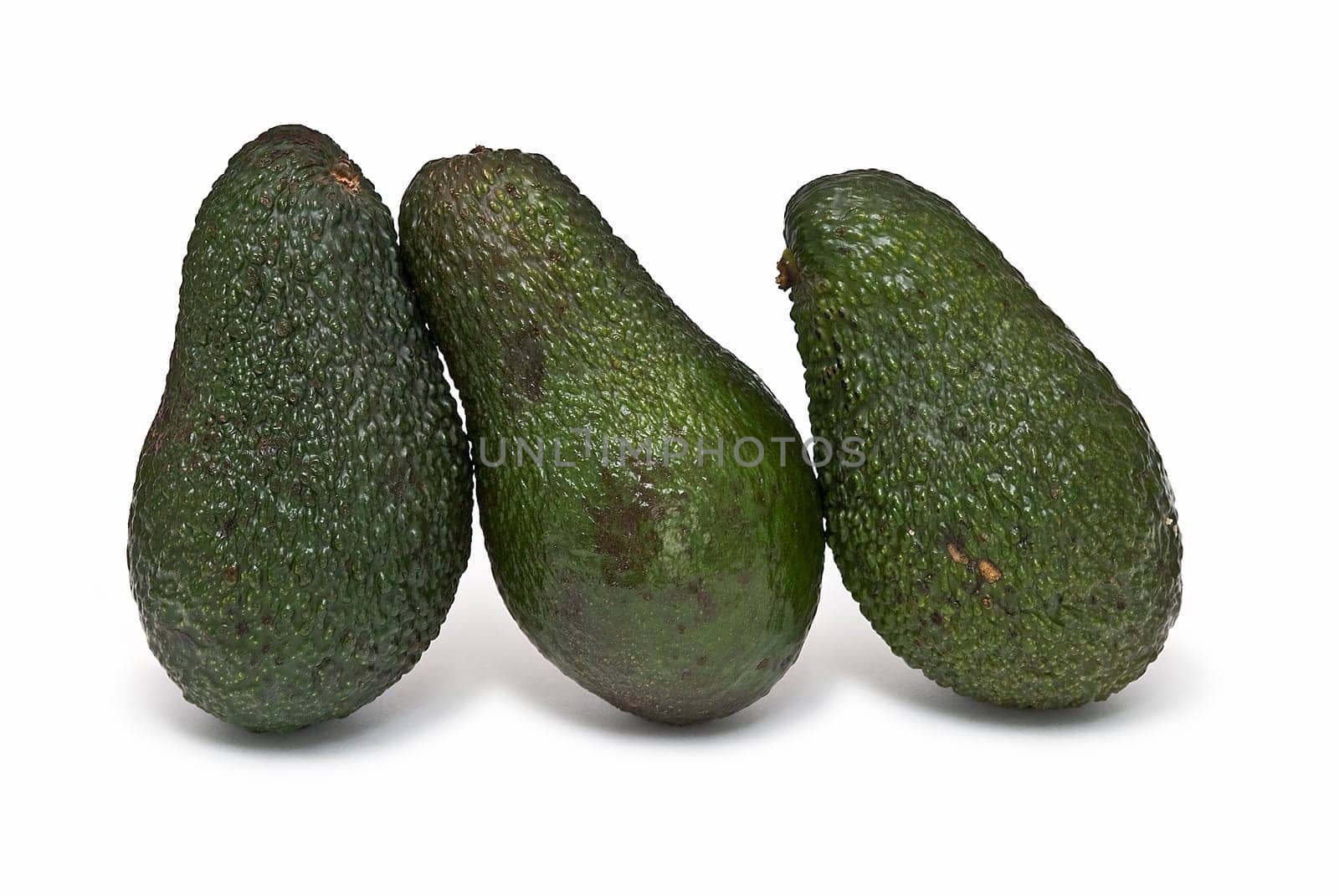 Fresh avocados isolated on a white background.