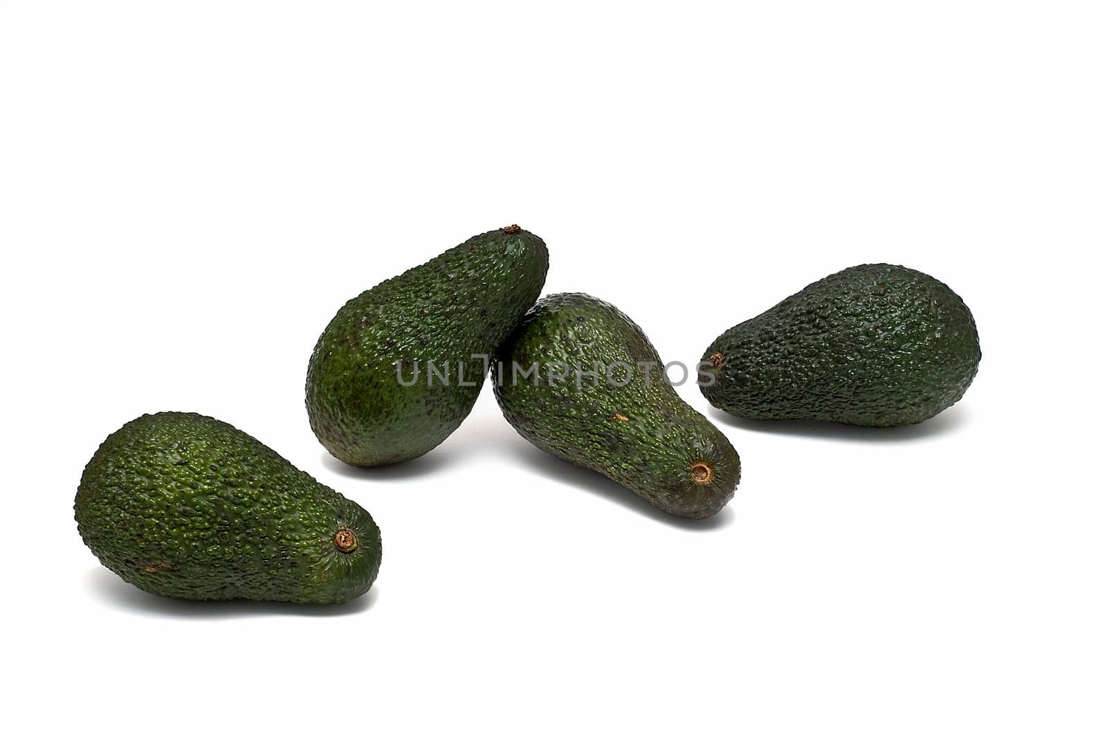 Fresh avocados isolated on a white background.