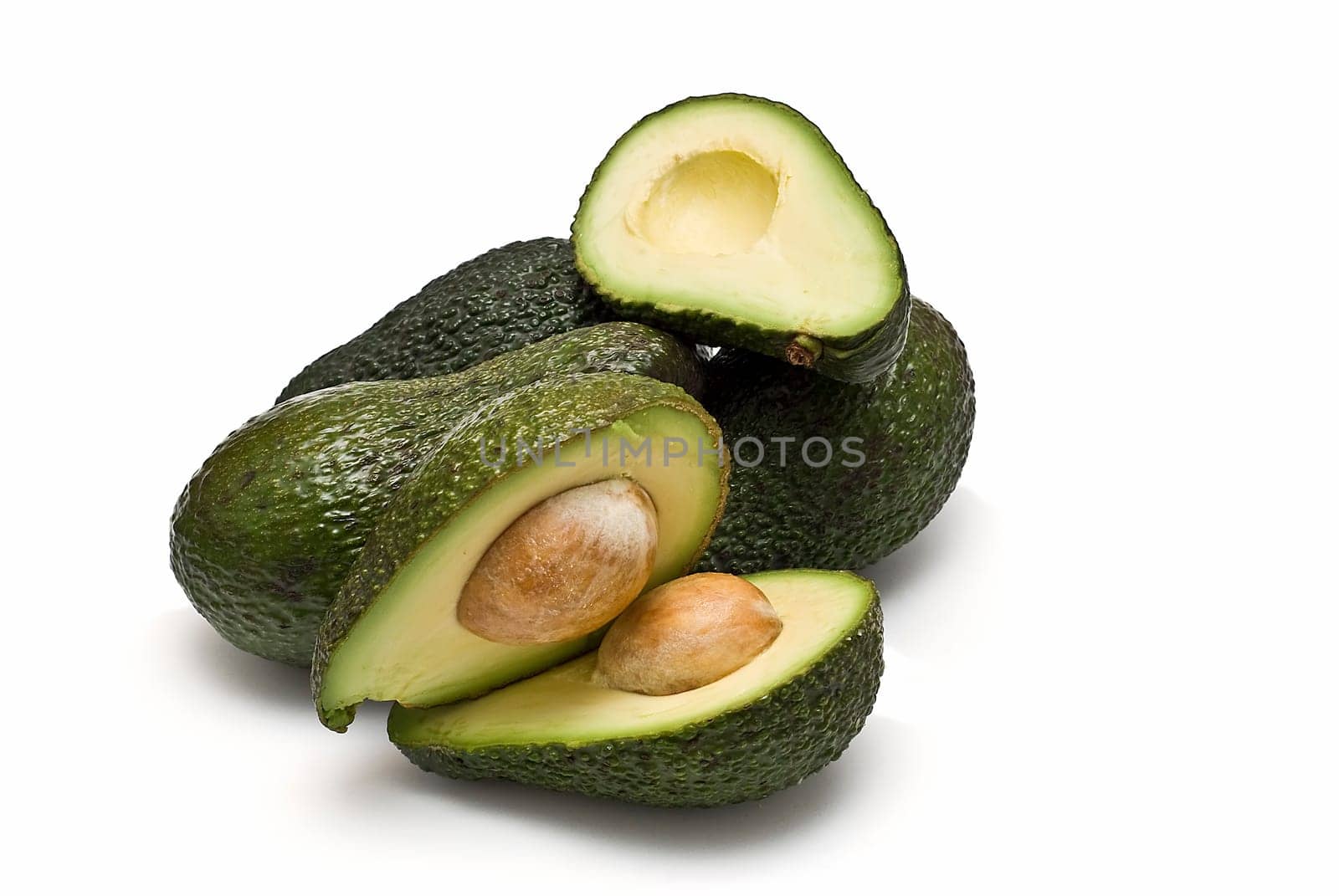 Fresh avocados isolated on a white background.