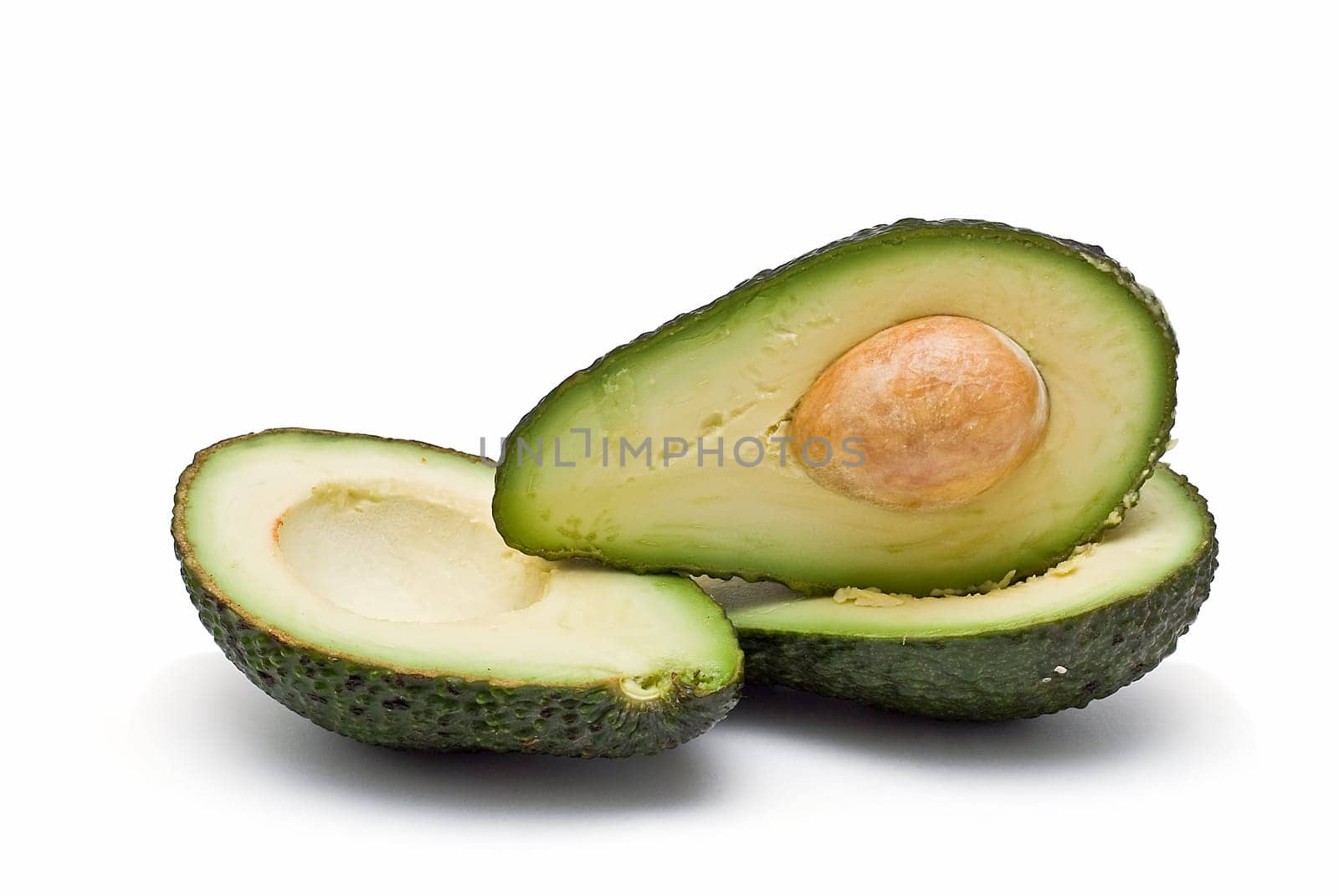 Fresh avocados isolated on a white background.