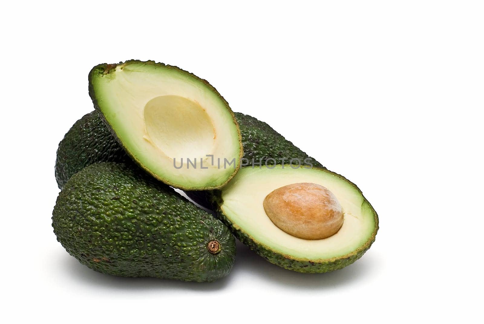 Fresh avocados isolated on a white background.