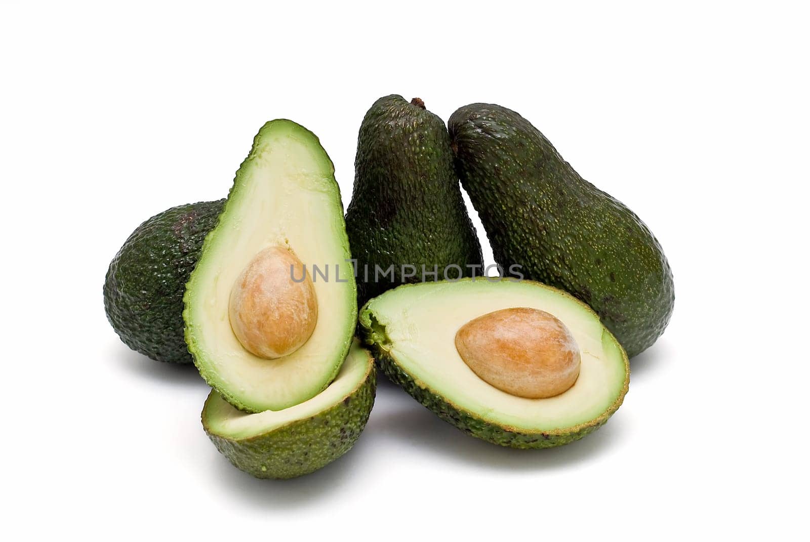 Fresh avocados isolated on a white background.