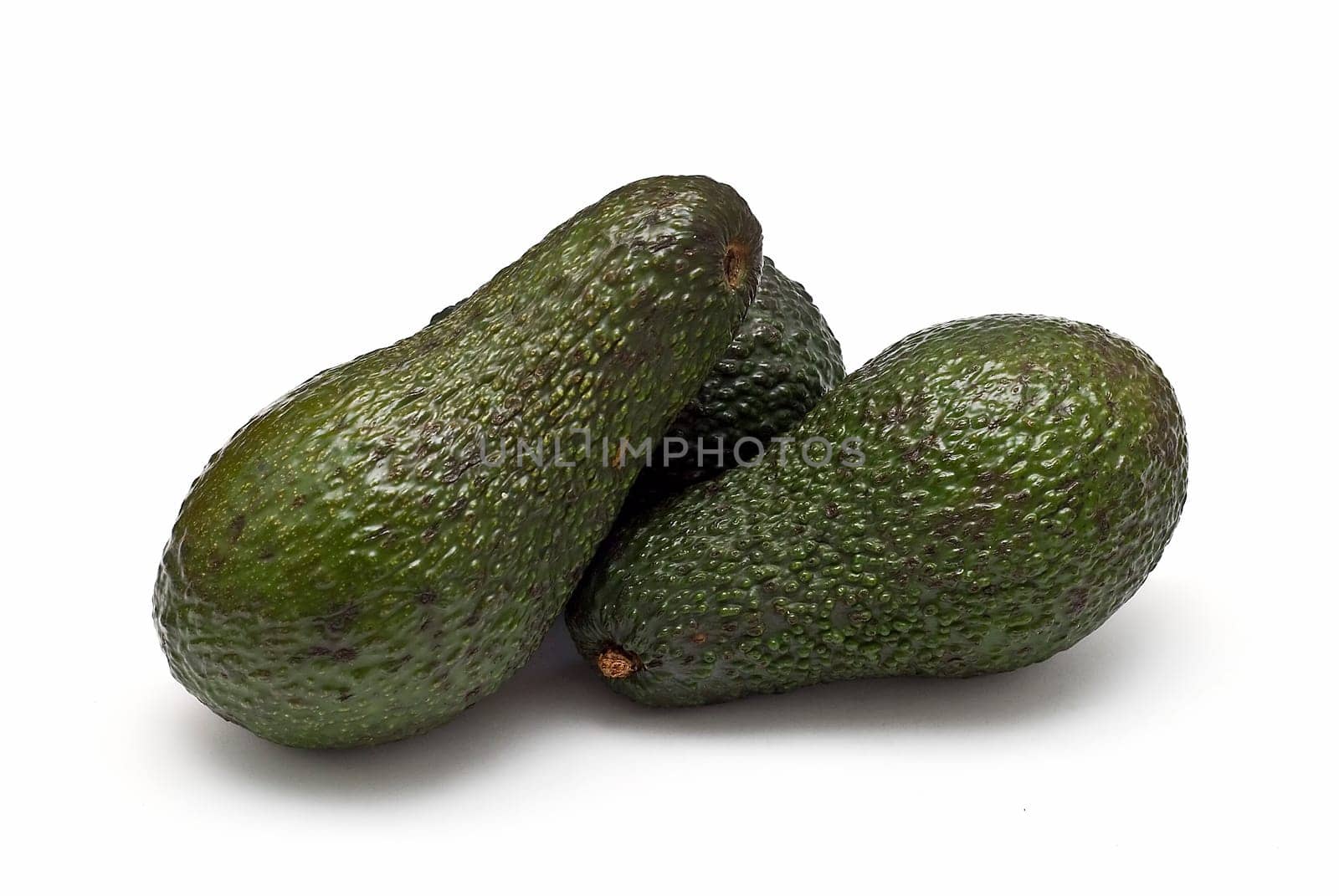 Fresh avocados isolated on a white background.