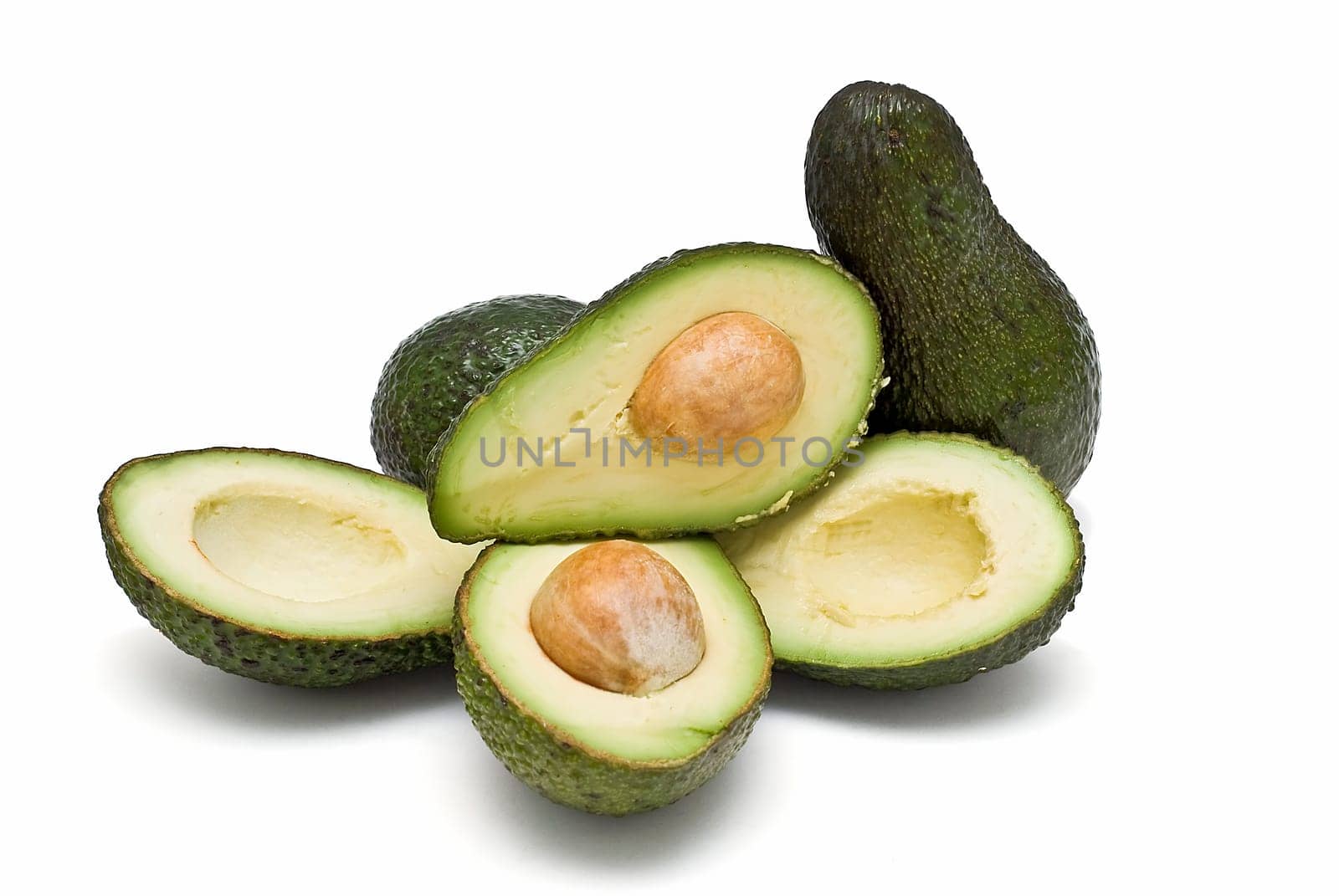 Fresh avocados isolated on a white background.