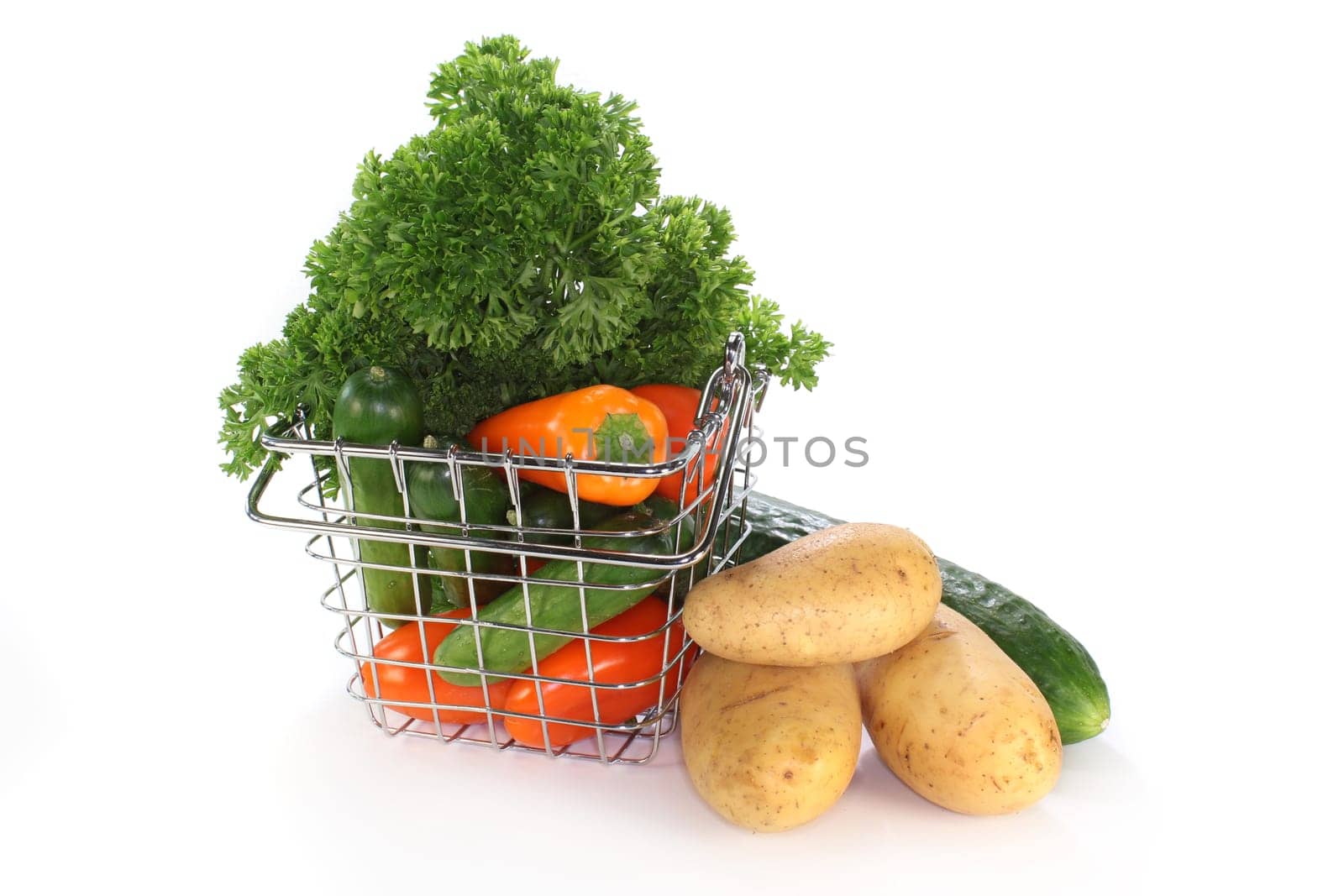 a shopping basket filled with colorful vegetables