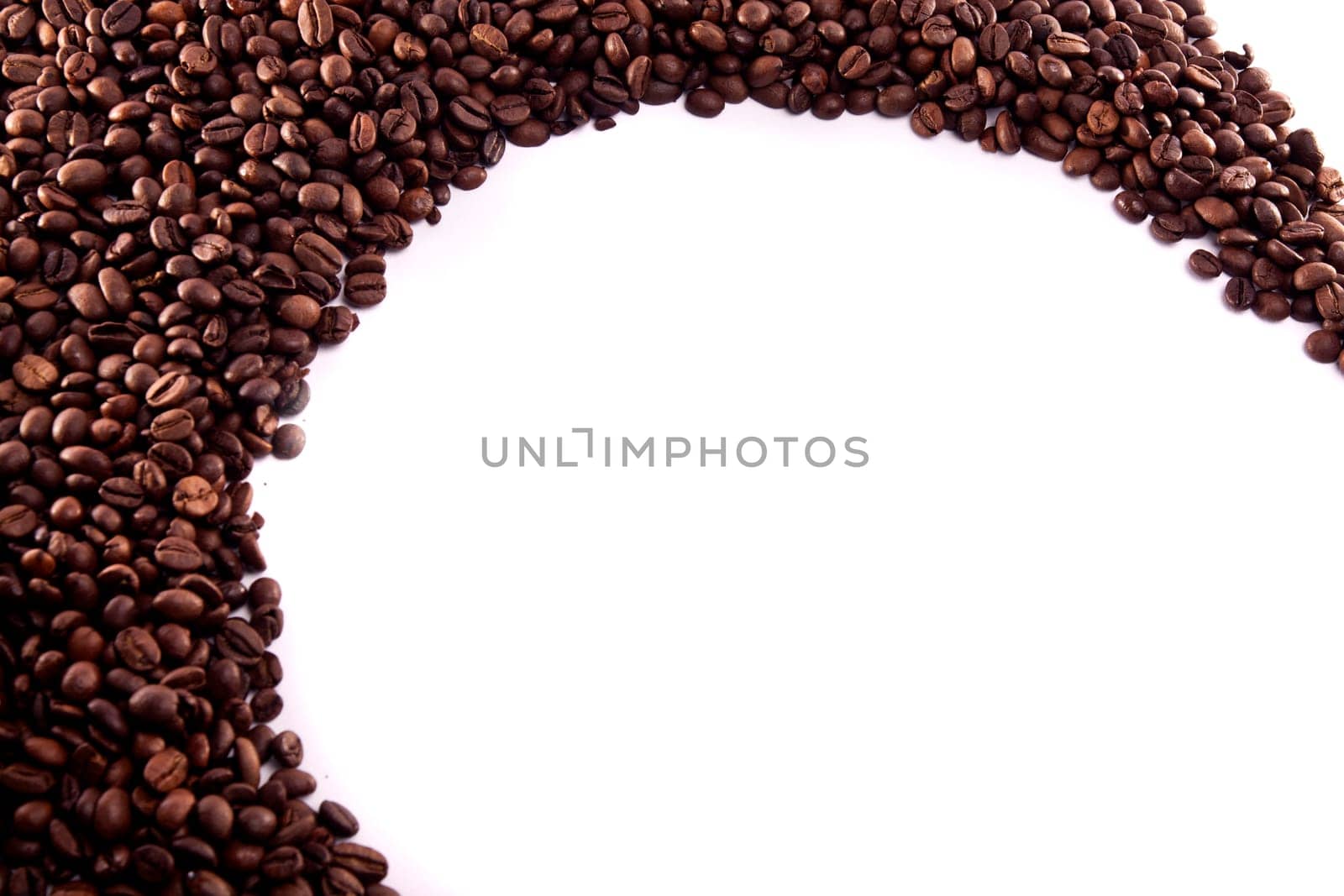 Close up view of a bunch of roasted beans of coffee.