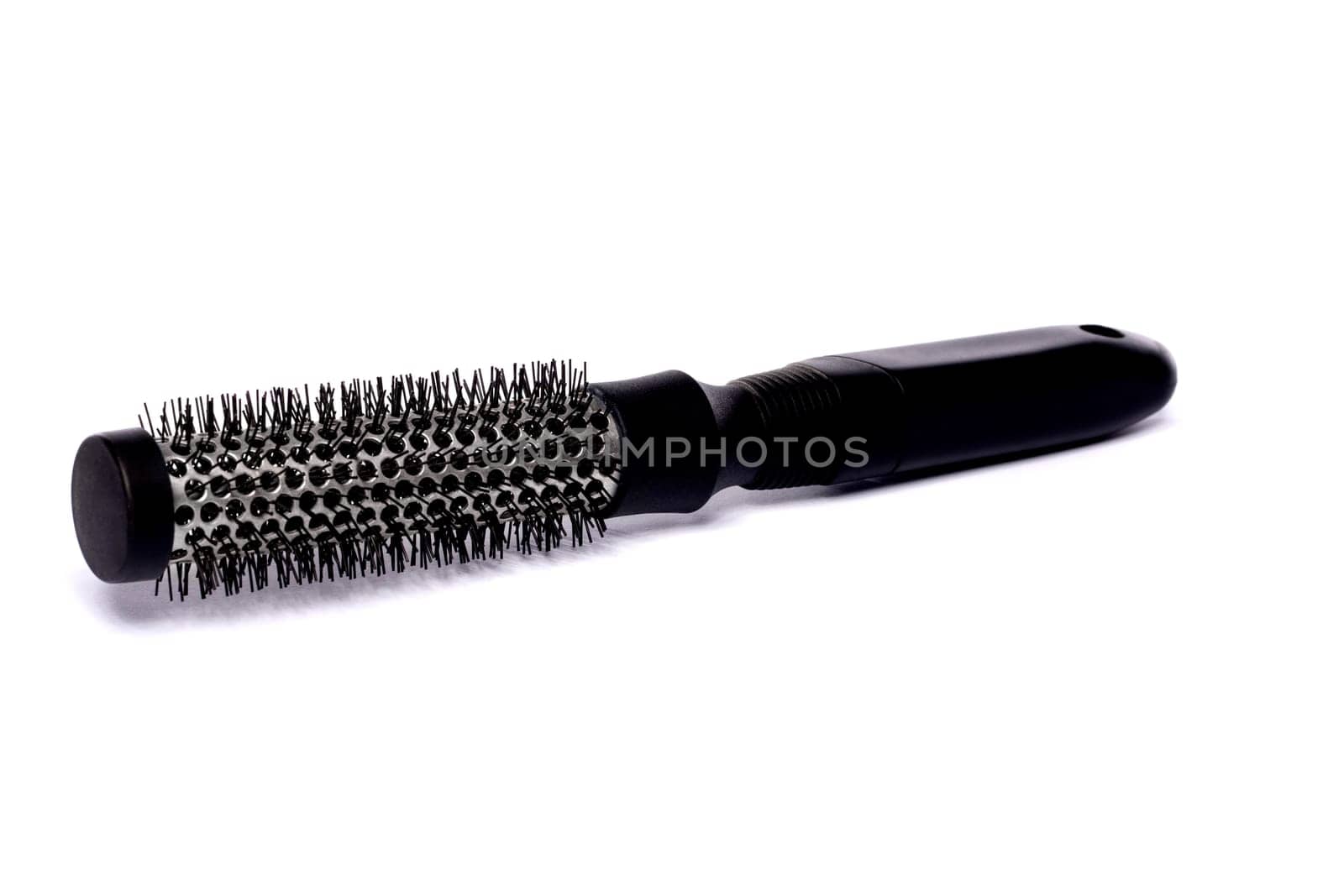 Close up view of a hair brush isolated on a white background.