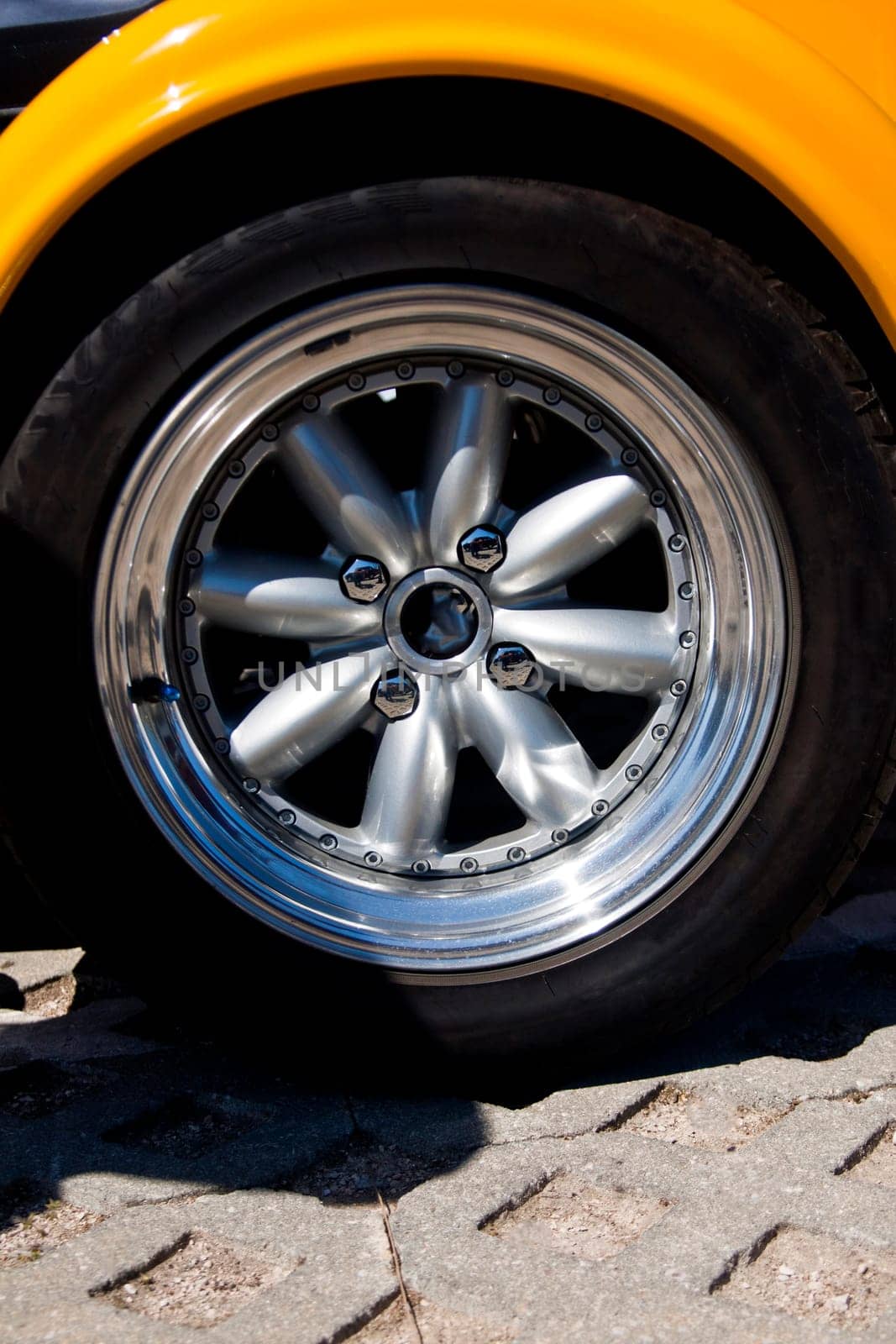 Close up view of the detail of a wheel from a car.