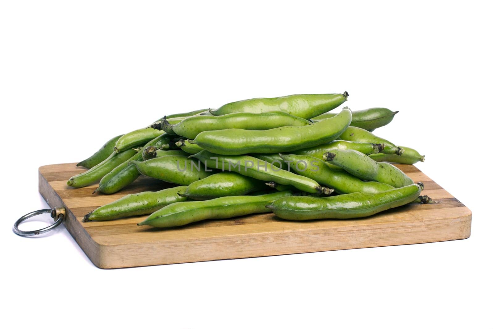 Close up view of some broad beans isolated on a white background.