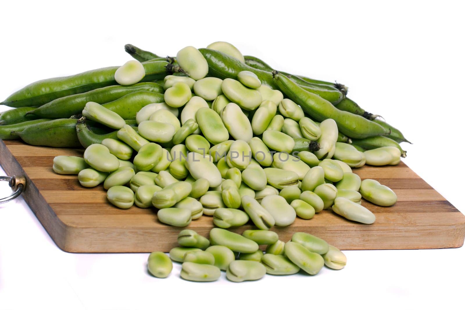Close up view of some broad beans isolated on a white background.