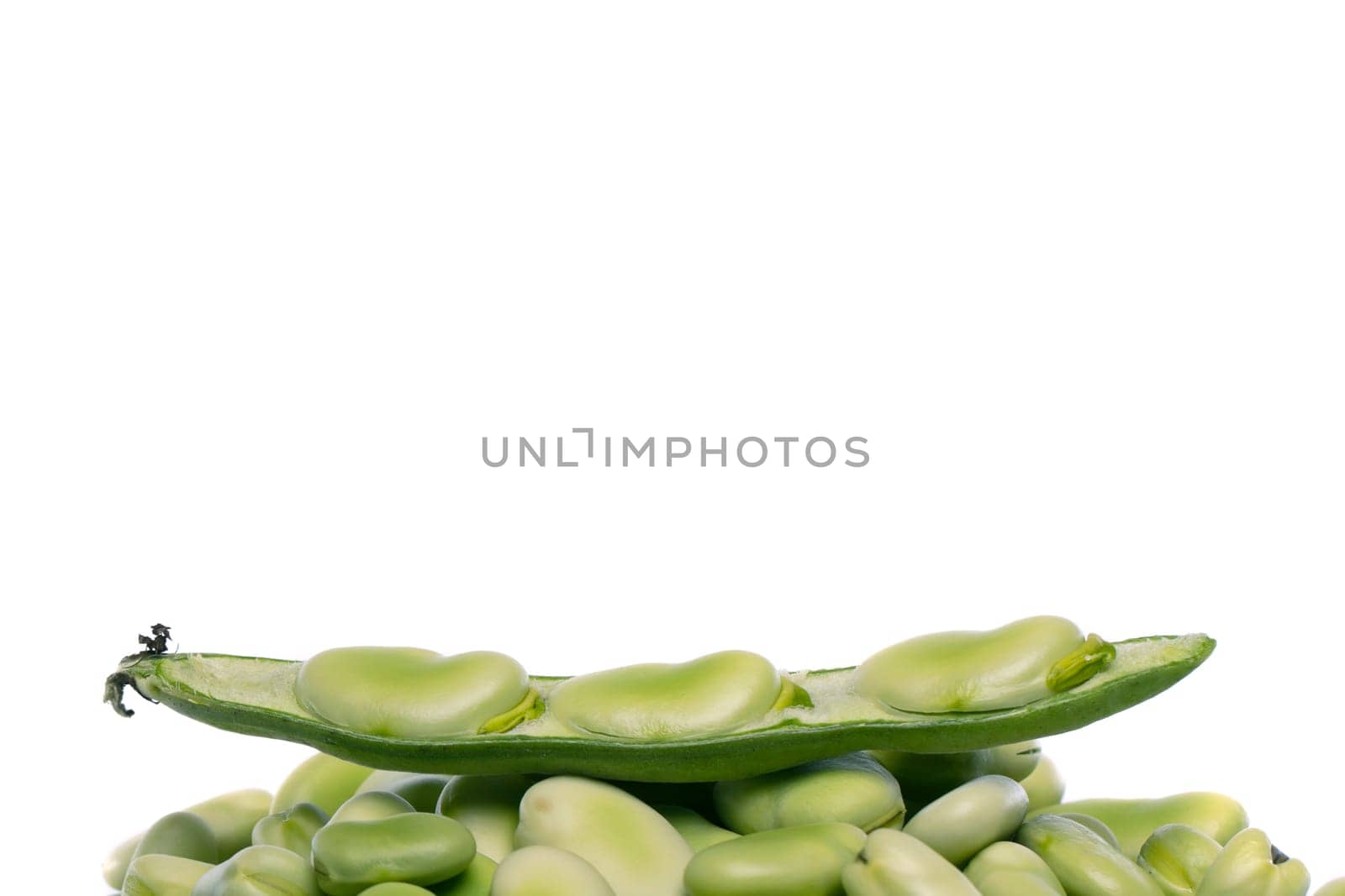 Close up view of some broad beans isolated on a white background.