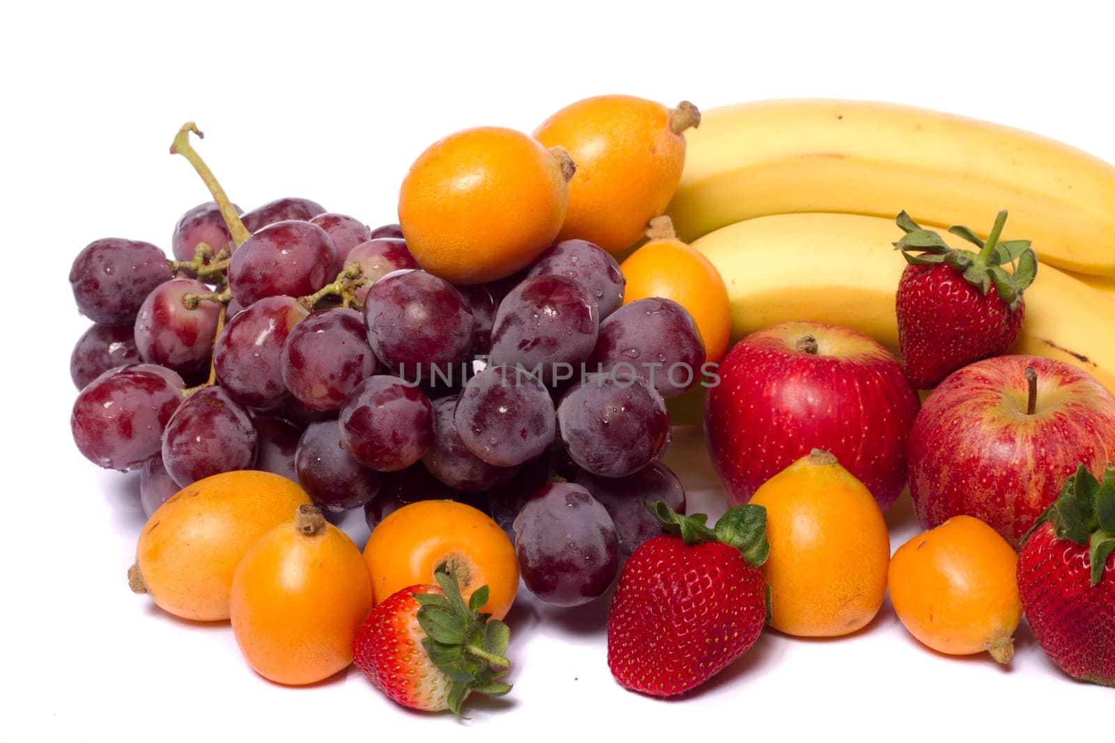 Close up view of a mix of several fruits isolated on a white background.