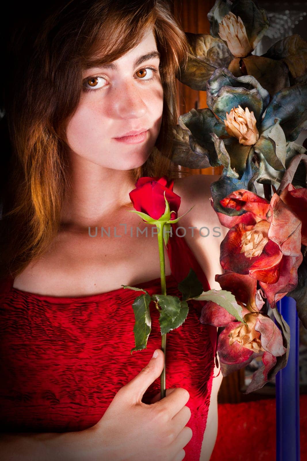 View of a beautiful young girl in a red dress on a living room.
