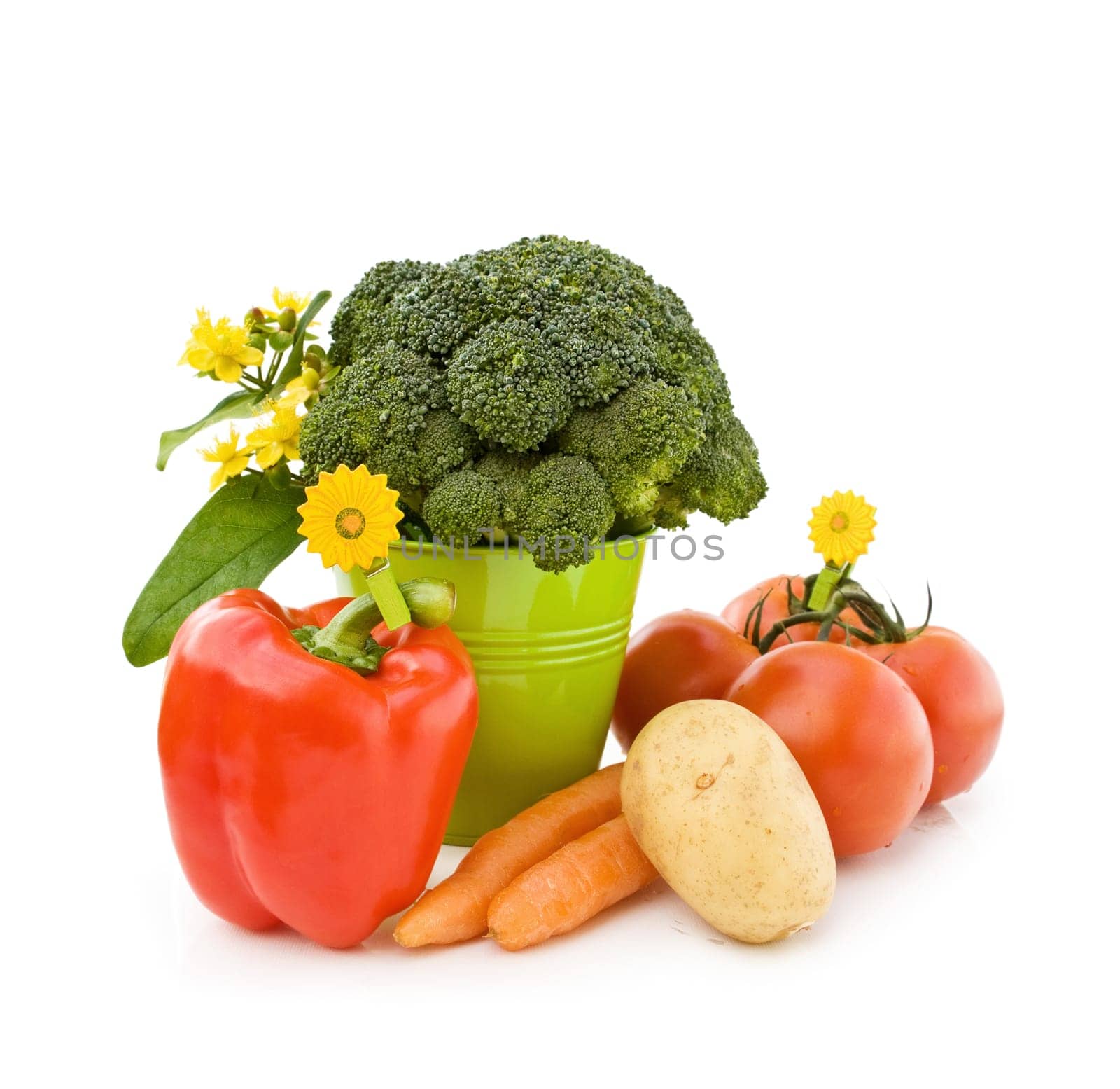Healthy eating with tomatoes, potato, broccoli, peppers and carrots fresh from the garden. Isolated over white background.