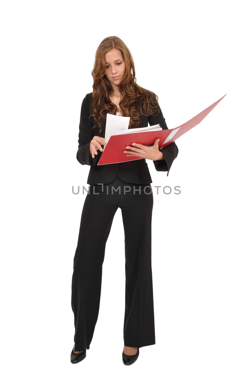 Businesswoman leafing through red folder