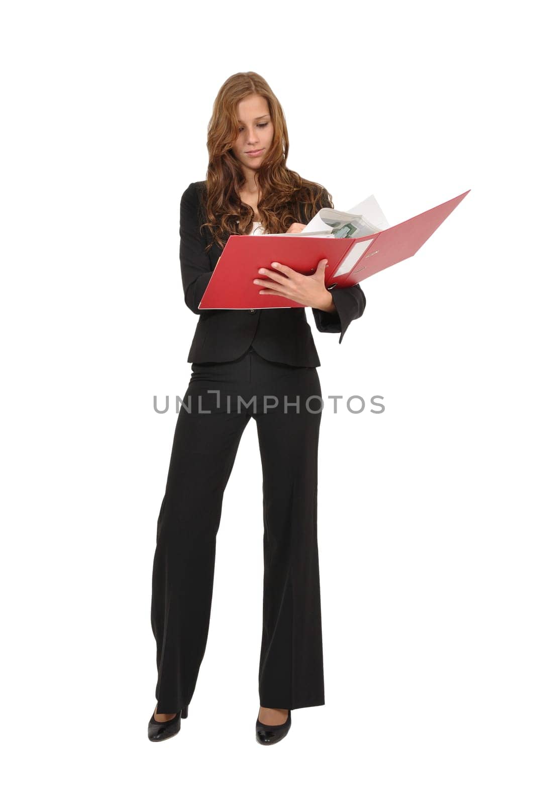 Businesswoman reads a page from a red folder