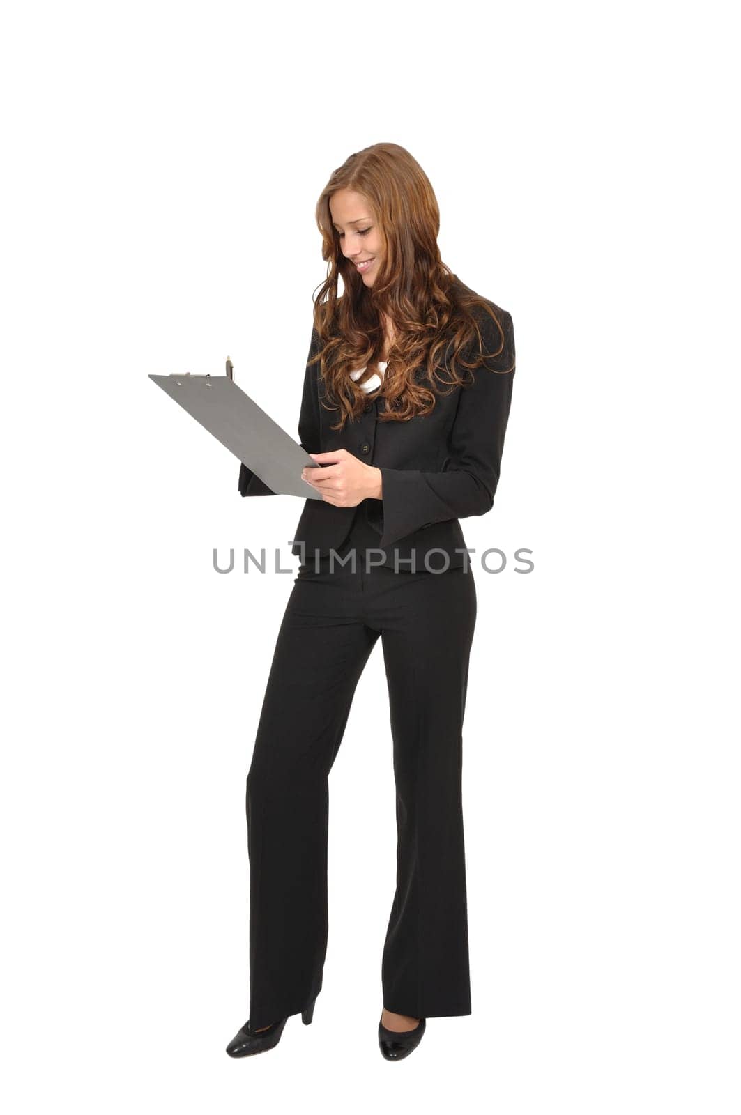 Businesswoman with clipboard taking notes