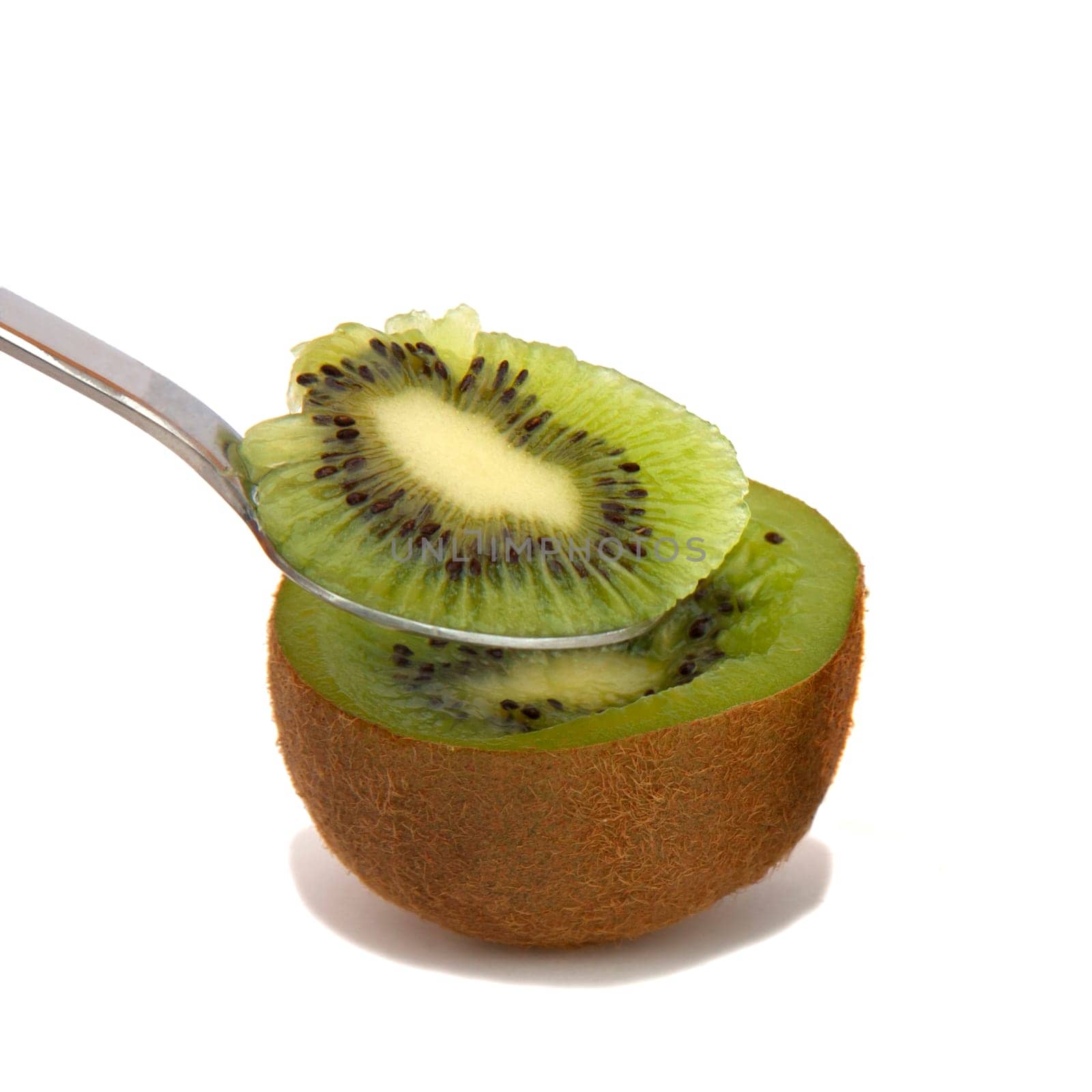 A kiwi half with a spoon