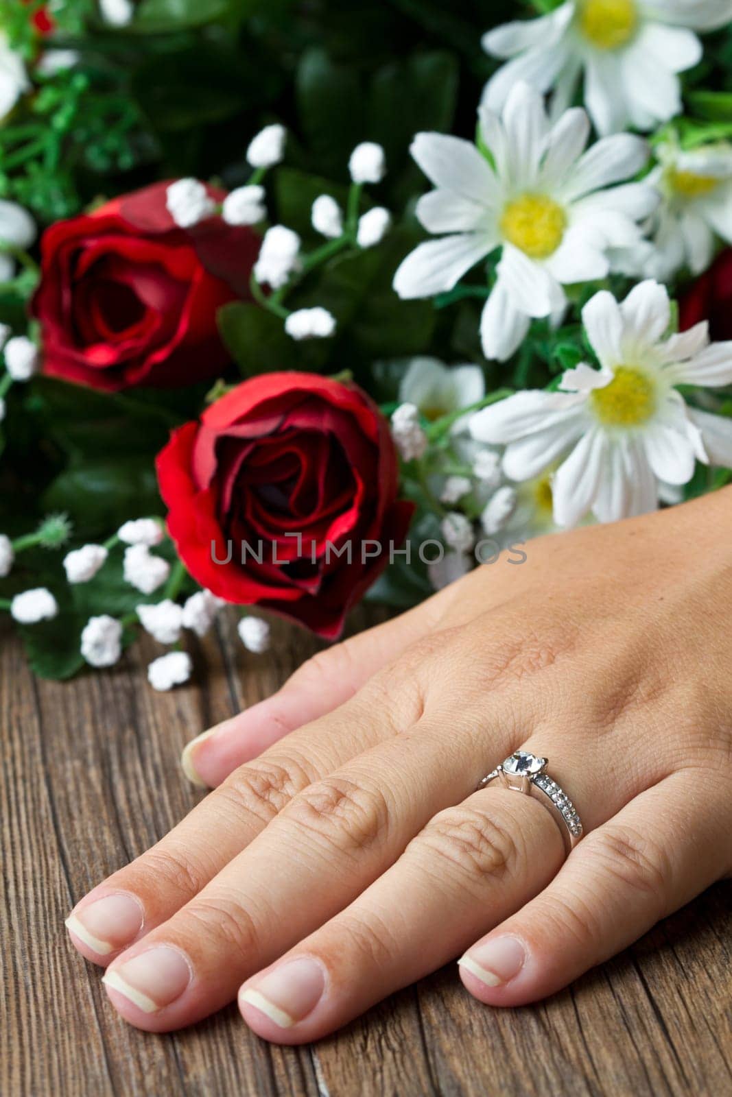 engagement ring and flower composition