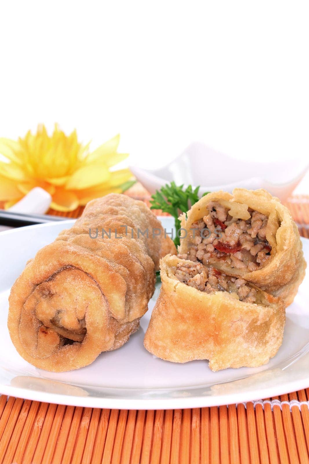 a spring roll filled with minced meat and tomatoes