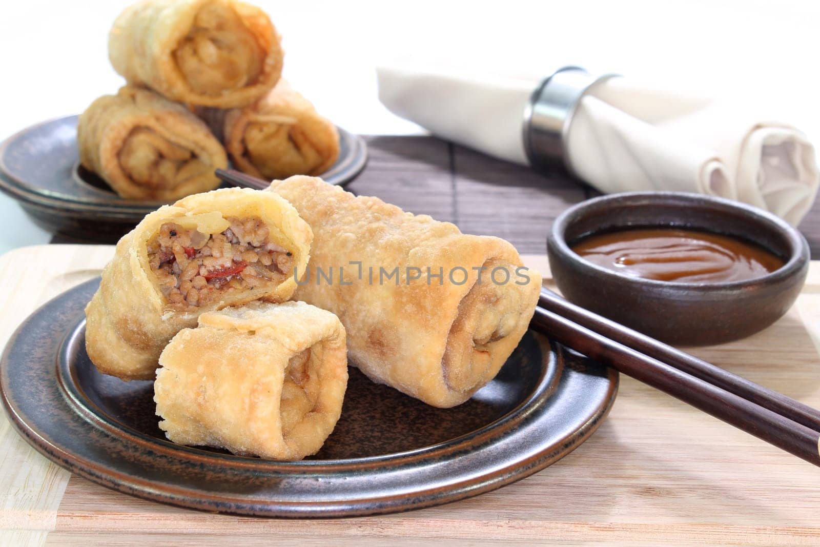 a spring roll filled with minced meat and tomatoes