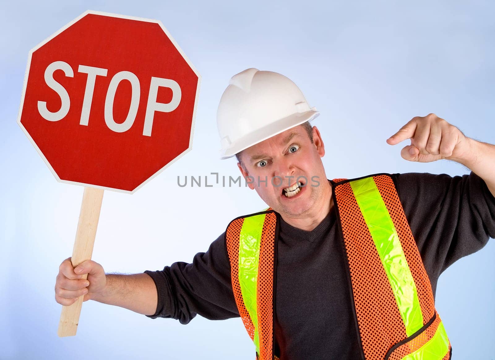 A construction worker is angrily asking to stop doing something. Conceptual for many applications