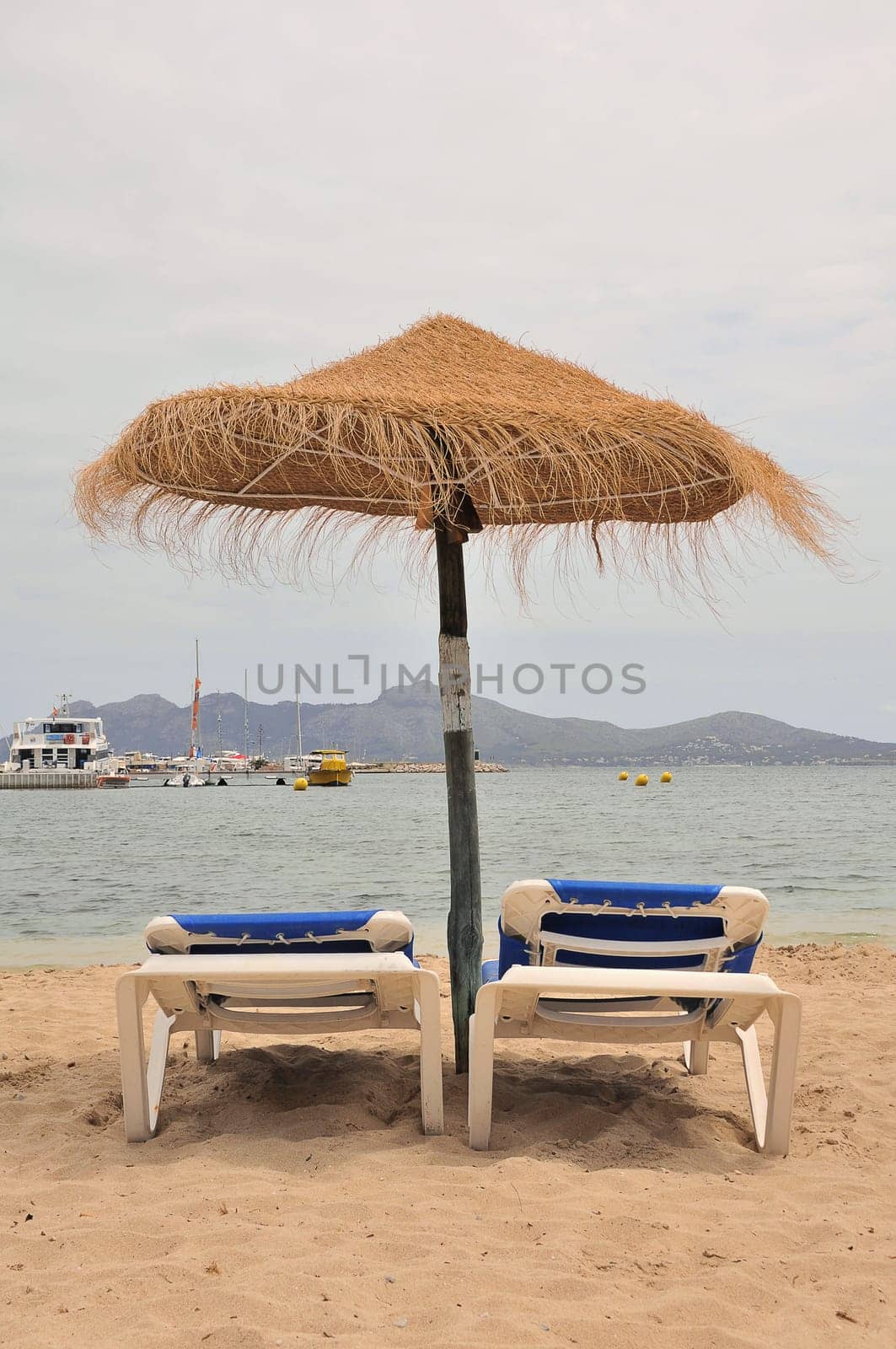 Parasol with sunbeds