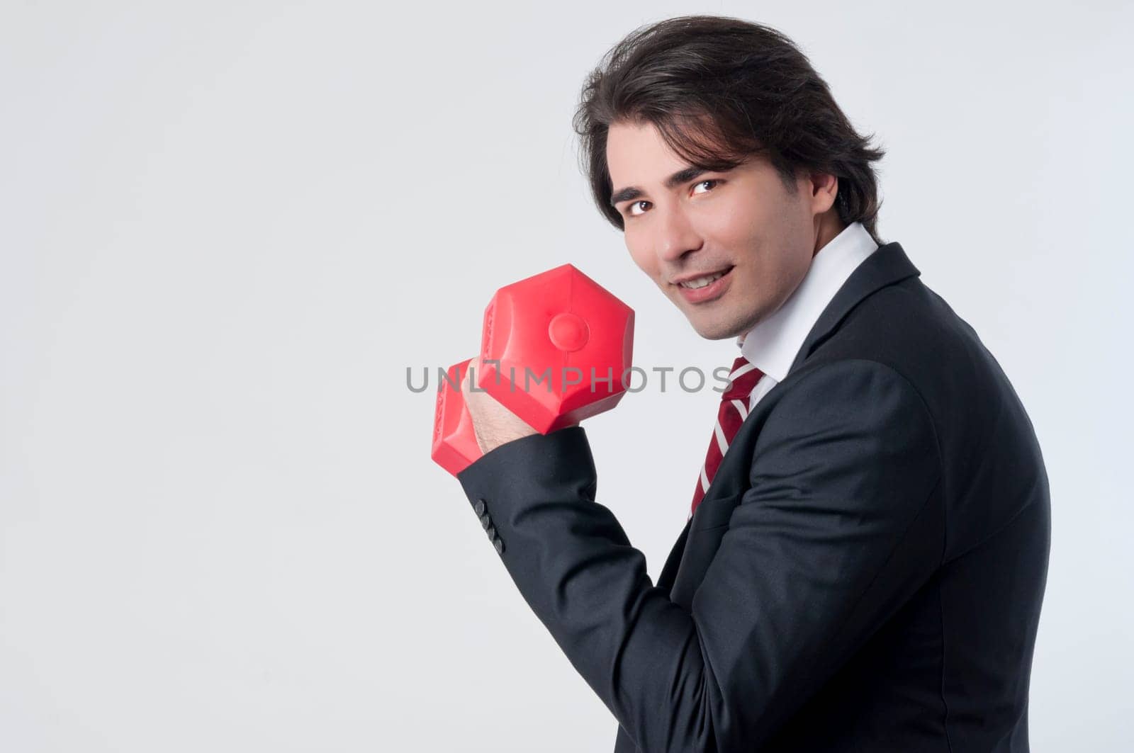 Businessman training with a weightlifting