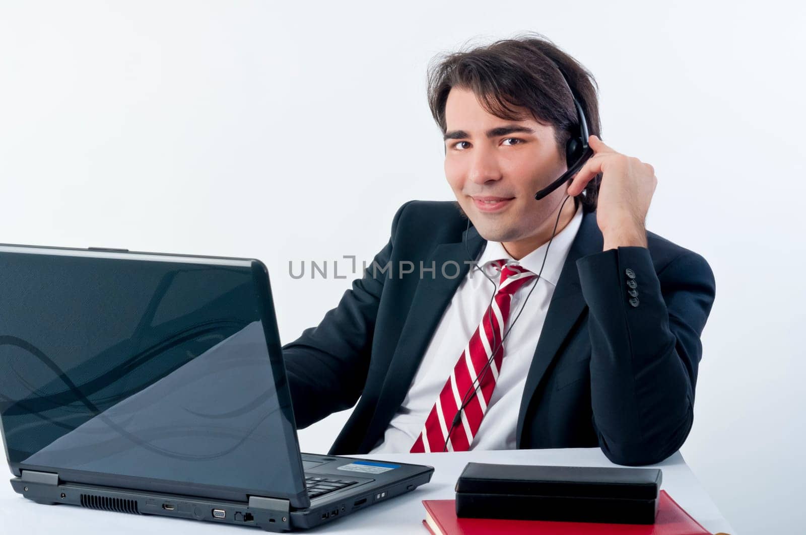 Businessman talking on the phone isolated on white background