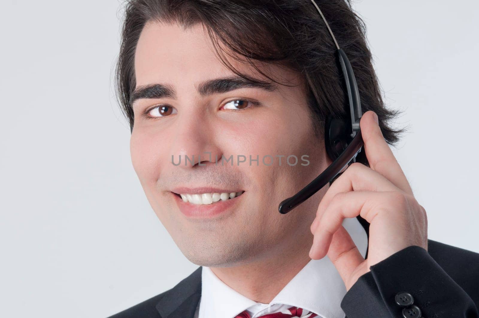 Isolated studio picture from a young callcenter agent